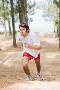 Man running in forest